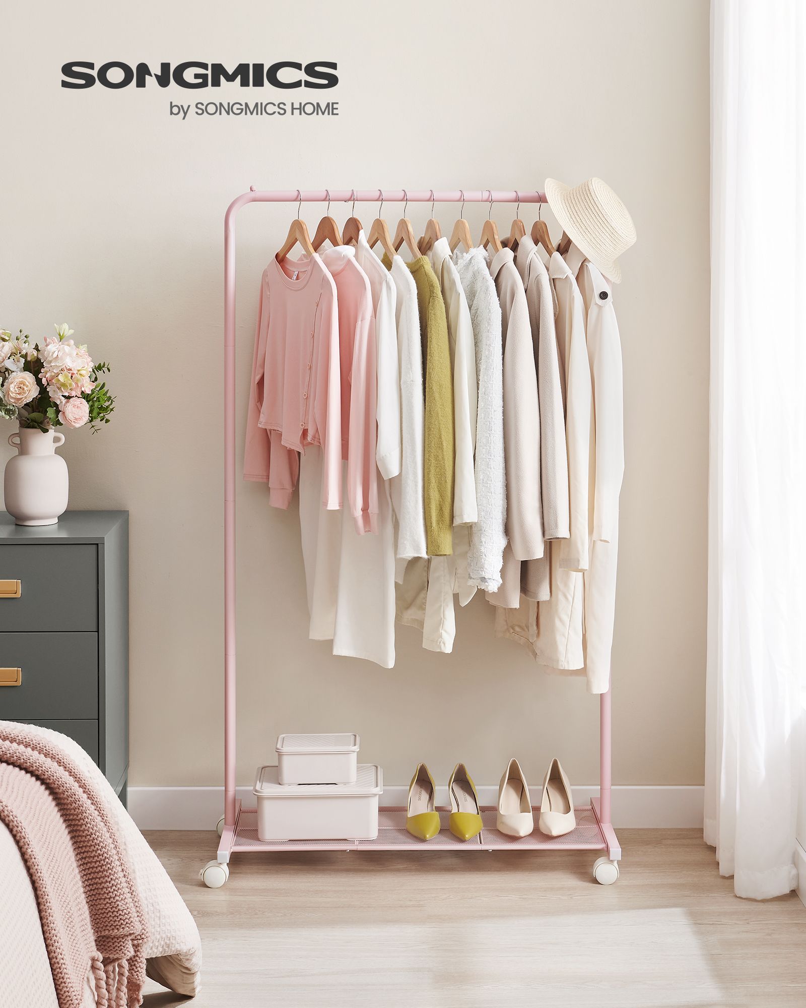 Clothing rack 91 cm wide on pastel pink wheels